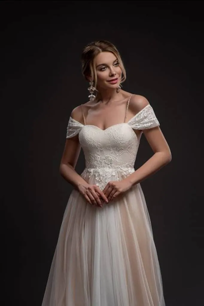 ---2022 cheap wedding dress made in tulle and lace with a sweetheart neckline, drooping lace straps and A line style skirt--