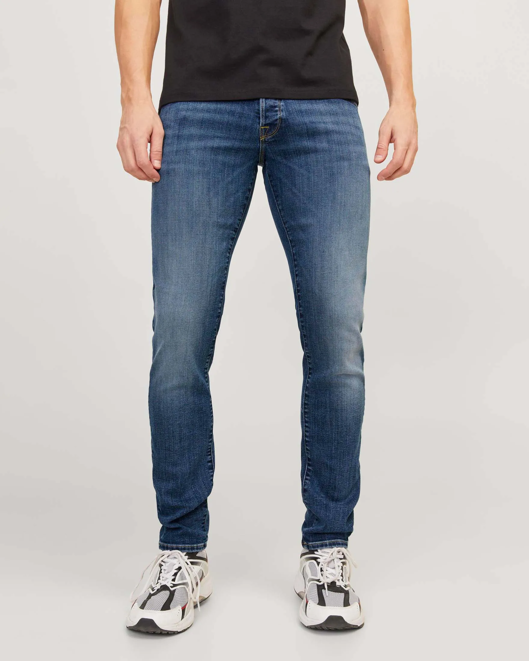 Jeans slim-fit a vita bassa in cotone stretch lavaggio medio stone washed con leggere sabbiature