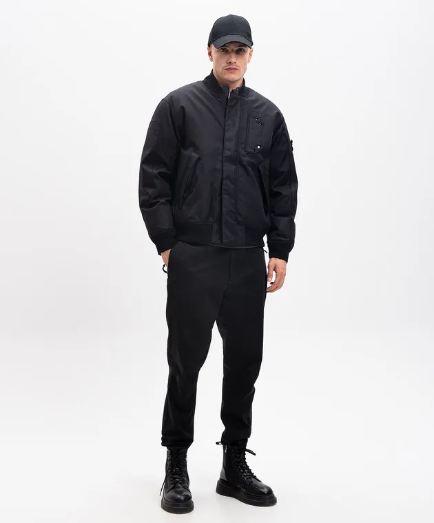 Stone Island Bomber in piumino nero con patch logo 811546536